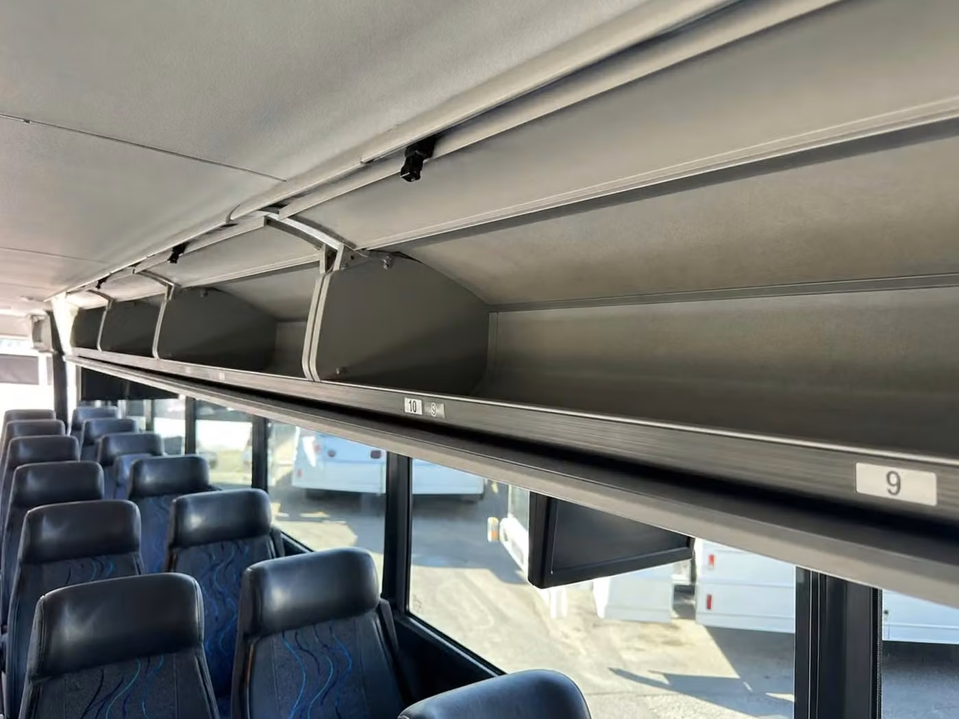 stanton 56 passenger charter bus overhead storage